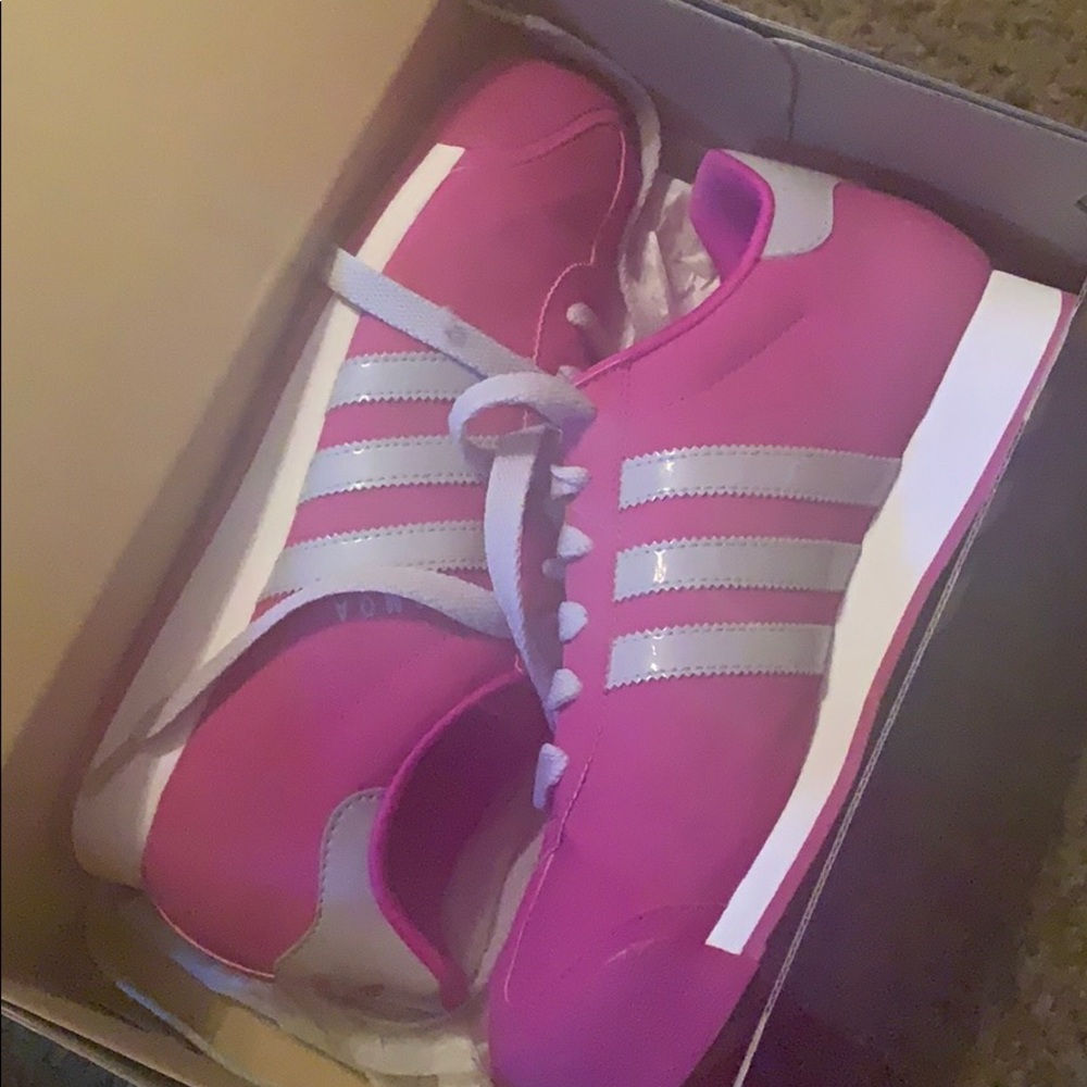 Pink women’s Adidas tennis shoes